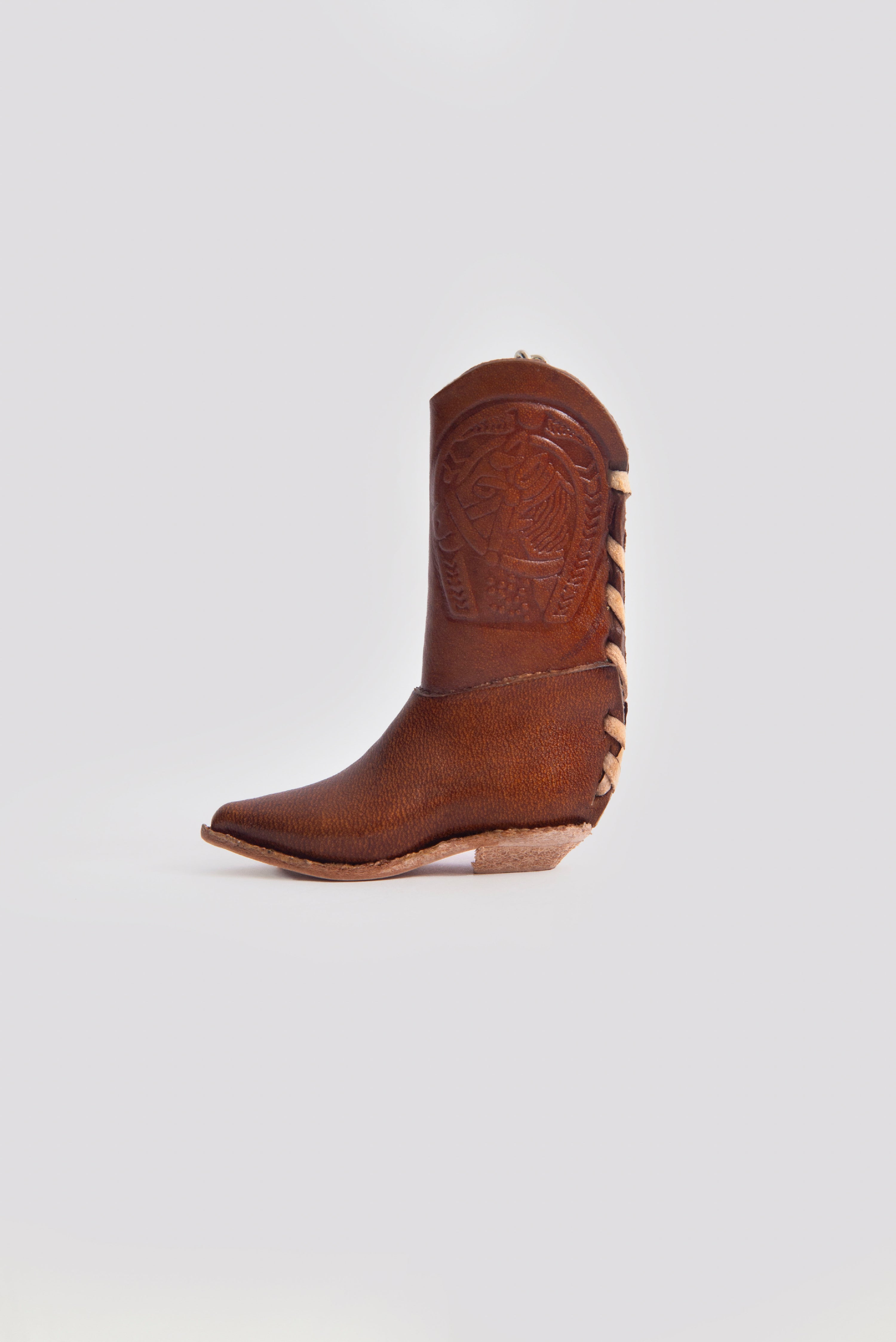 Handgefertigte Feuerzeughülle aus Leder im Cowboy-Stiefel-Design, Mexiko. Artesania. Braun