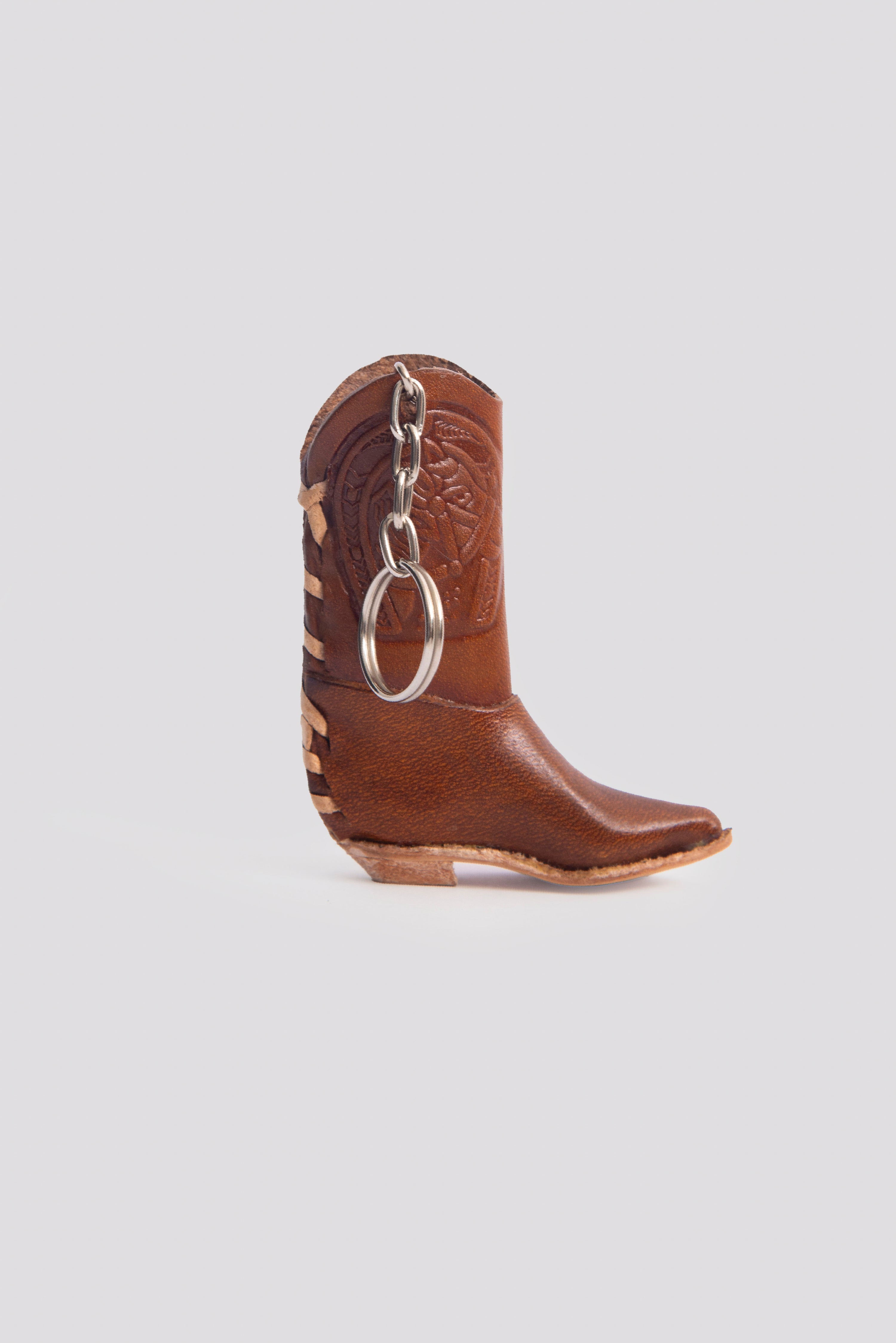 Handgefertigte Feuerzeughülle aus braunem Leder im Cowboy-Stiefel-Design, Mexiko. Schlüsselanhänger Cowboy 